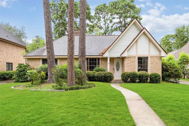 3618 Coltwood Dr, Spring, TX 77388 - english style home featuring a front yard, a shingled roof, brick siding, and stucco siding