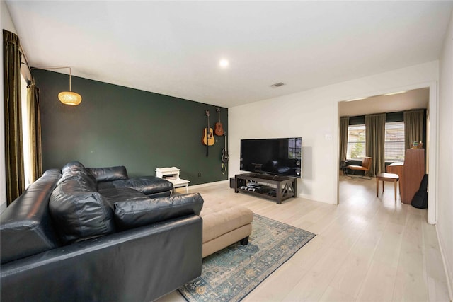 3618 Coltwood Dr, Spring, TX 77388 - living room featuring light wood finished floors and an accent wall