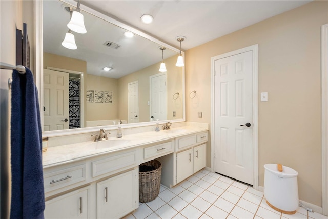 3618 Coltwood Dr, Spring, TX 77388 - bathroom with double vanity and tile patterned flooring