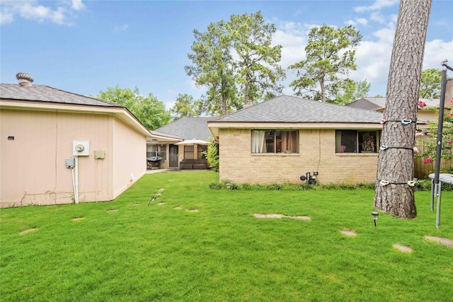 3618 Coltwood Dr, Spring, TX 77388 - rear view of property with a yard and roof with shingles