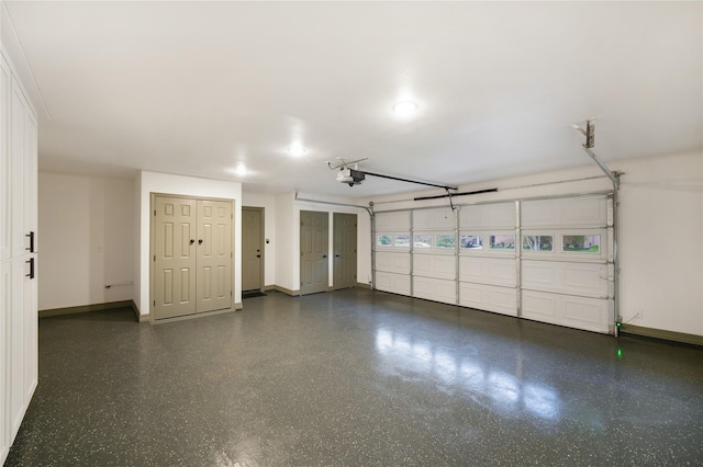 10011 Cliffwood Dr, Houston, TX 77035 - garage featuring baseboards and a garage door opener
