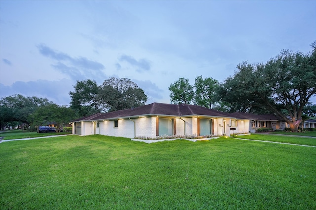 10011 Cliffwood Dr, Houston, TX 77035 - ranch-style home with a front lawn, a garage, and brick siding