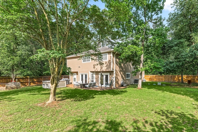 600 Crystal River Rd, Conroe, TX 77316 - back of house with a fenced backyard, french doors, and a patio