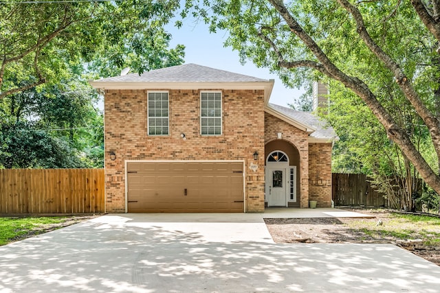 600 Crystal River Rd, Conroe, TX 77316 - traditional-style home featuring brick siding, driveway, a shingled roof, and an attached garage