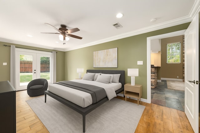 600 Crystal River Rd, Conroe, TX 77316 - bedroom featuring french doors, access to exterior, ornamental molding, wood finished floors, and recessed lighting