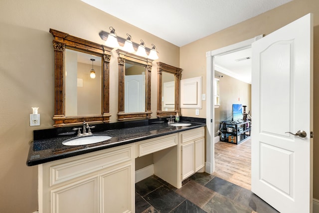 600 Crystal River Rd, Conroe, TX 77316 - bathroom featuring double vanity and baseboards