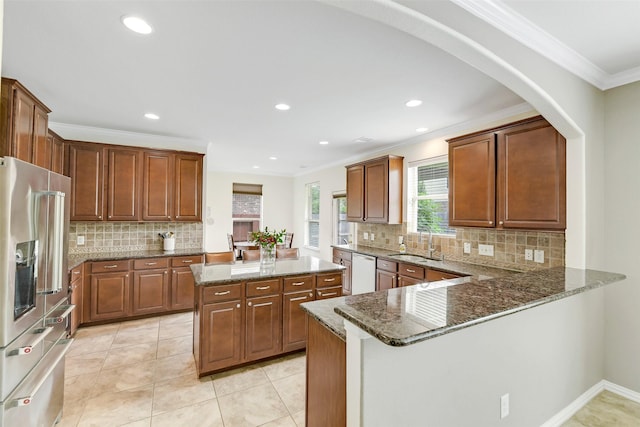 12106 Coldwater Cove Ln, Cypress, TX 77433 - kitchen featuring stainless steel fridge, dishwashing machine, decorative backsplash, crown molding, and dark stone counters