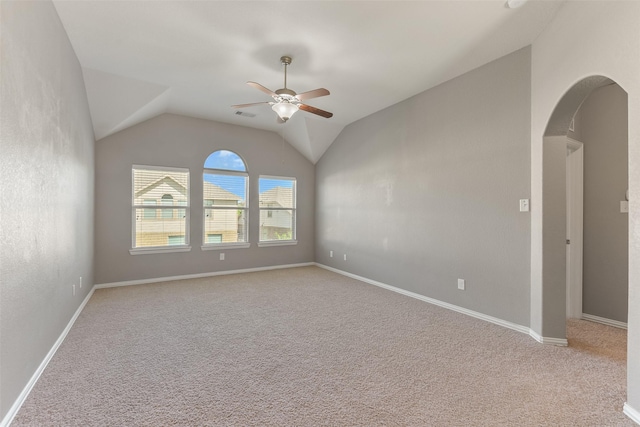 12106 Coldwater Cove Ln, Cypress, TX 77433 - carpeted empty room with a ceiling fan, arched walkways, and vaulted ceiling