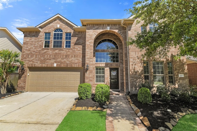 12106 Coldwater Cove Ln, Cypress, TX 77433 - traditional home with an attached garage, brick siding, and concrete driveway