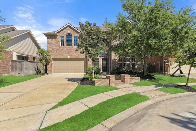 12106 Coldwater Cove Ln, Cypress, TX 77433 - view of front of property with brick siding, a garage, driveway, and a front yard