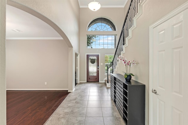 12106 Coldwater Cove Ln, Cypress, TX 77433 - entrance foyer featuring arched walkways, crown molding, and wood finished floors