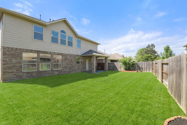 12106 Coldwater Cove Ln, Cypress, TX 77433 - rear view of house with brick siding and a fenced backyard