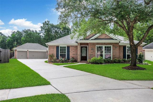 28006 Brendon Trail Ct, Spring, TX 77386 - view of front of property featuring brick siding, a detached garage, an outbuilding, and roof with shingles