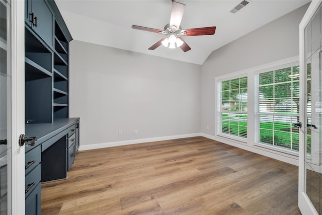 28006 Brendon Trail Ct, Spring, TX 77386 - unfurnished living room with vaulted ceiling, light wood-style floors, and ceiling fan