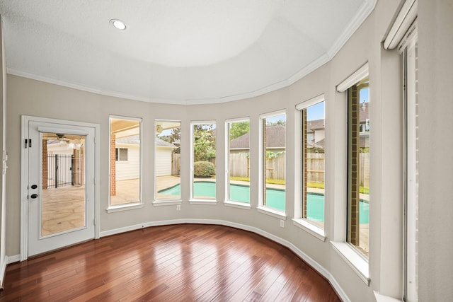 22419 Rippling Shore Ct, Katy, TX 77494 - unfurnished sunroom with hardwood / wood-style floors and crown molding