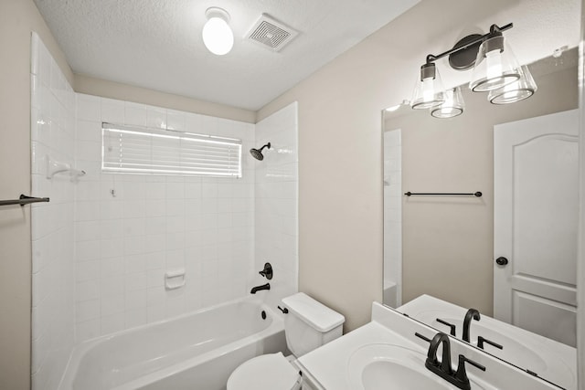 22419 Rippling Shore Ct, Katy, TX 77494 - bathroom with shower / washtub combination, vanity, and a textured ceiling