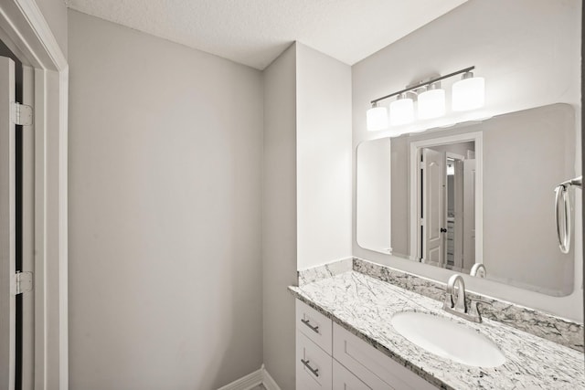 22419 Rippling Shore Ct, Katy, TX 77494 - bathroom featuring vanity and a textured ceiling