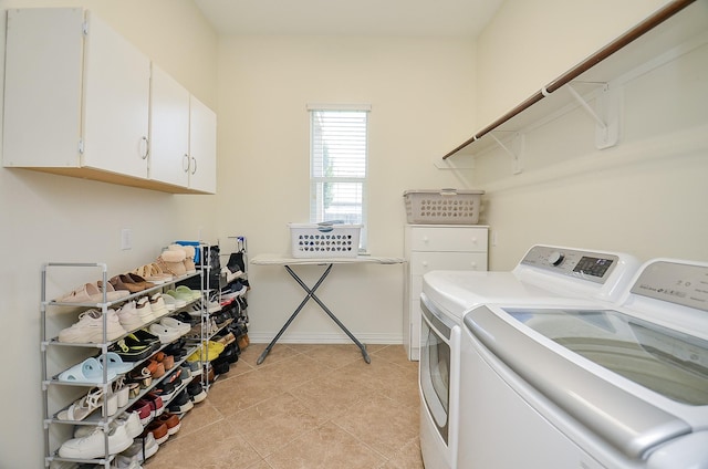 24914 Hazel Ranch Dr, Katy, TX 77494 - washroom featuring washing machine and dryer and cabinet space