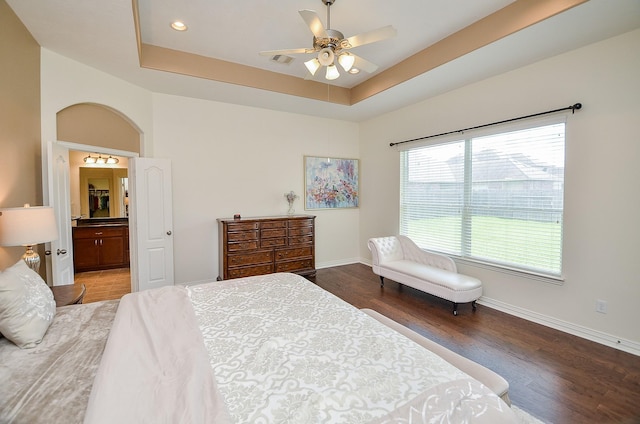 24914 Hazel Ranch Dr, Katy, TX 77494 - bedroom featuring wood finished floors, a raised ceiling, recessed lighting, ensuite bathroom, and ceiling fan