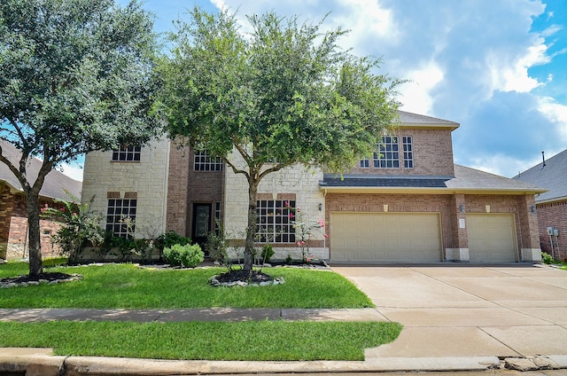 24914 Hazel Ranch Dr, Katy, TX 77494 - traditional-style house with concrete driveway, a front yard, brick siding, an attached garage, and roof with shingles