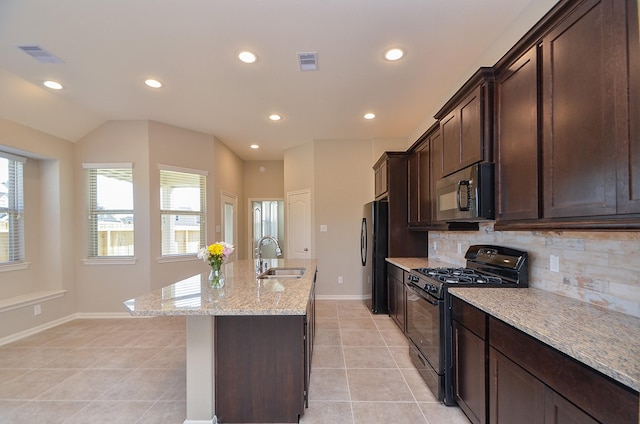 3238 Montclair Orchard Trce, Spring, TX 77386 - kitchen with black appliances, recessed lighting, decorative backsplash, light stone counters, and light tile patterned floors