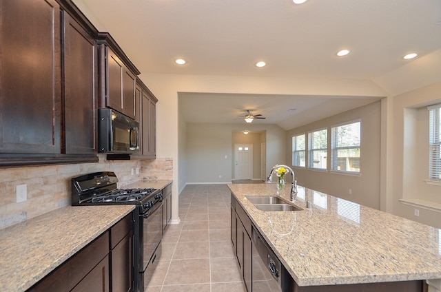 3238 Montclair Orchard Trce, Spring, TX 77386 - kitchen featuring black appliances, backsplash, a kitchen island with sink, dark brown cabinets, and ceiling fan