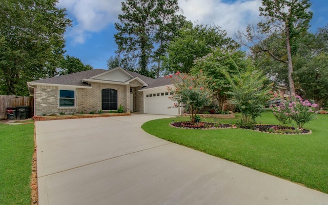 22718 Red Pine Dr, Tomball, TX 77375 - ranch-style house featuring a garage, driveway, brick siding, and roof with shingles