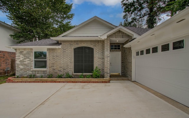 22718 Red Pine Dr, Tomball, TX 77375 - view of front of home with brick siding and roof with shingles