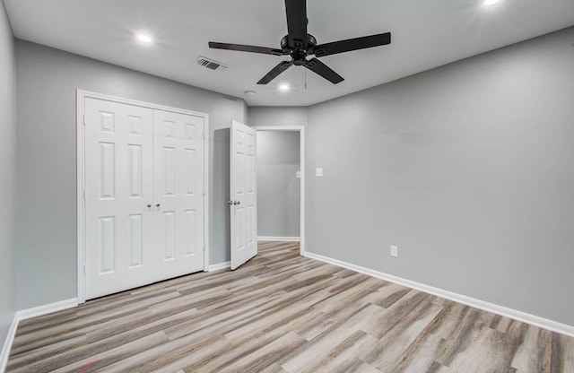 22718 Red Pine Dr, Tomball, TX 77375 - unfurnished bedroom with light wood-style floors, recessed lighting, a closet, and a ceiling fan