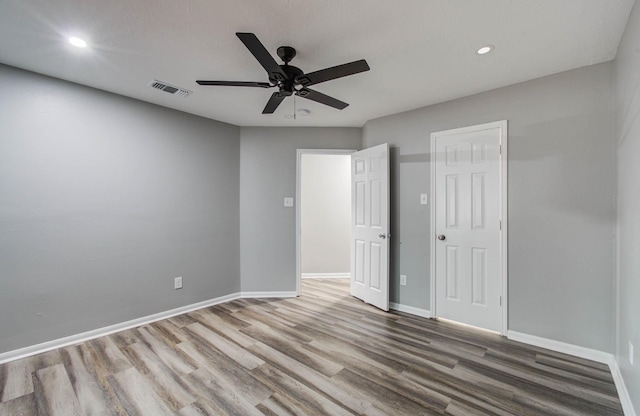22718 Red Pine Dr, Tomball, TX 77375 - unfurnished bedroom featuring wood finished floors, recessed lighting, and ceiling fan