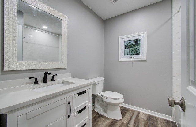 22718 Red Pine Dr, Tomball, TX 77375 - bathroom featuring wood finished floors and vanity