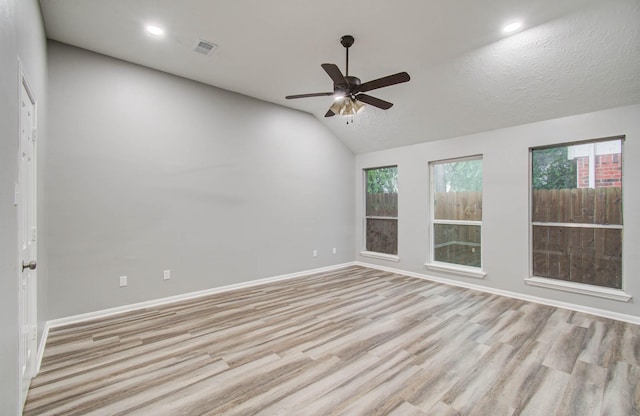 22718 Red Pine Dr, Tomball, TX 77375 - unfurnished room with lofted ceiling, light wood finished floors, a ceiling fan, and recessed lighting