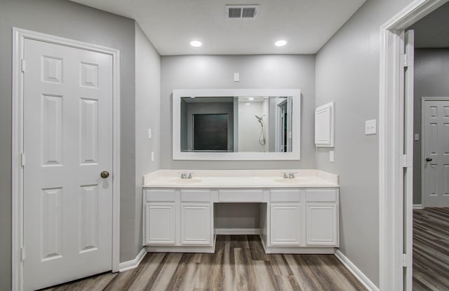 22718 Red Pine Dr, Tomball, TX 77375 - bathroom featuring wood finished floors, double vanity, and a shower