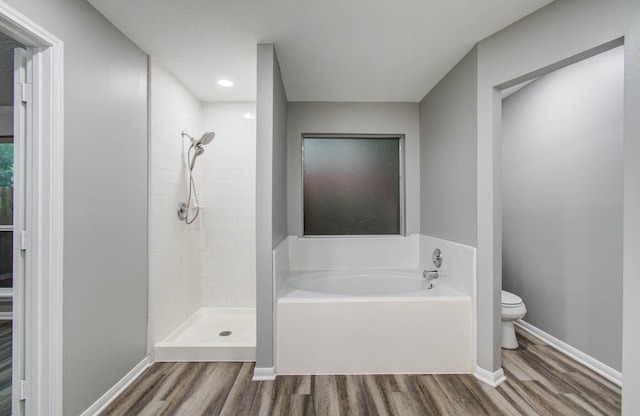 22718 Red Pine Dr, Tomball, TX 77375 - bathroom with wood finished floors, a bath, and a tile shower