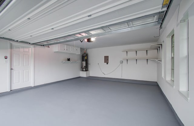 22718 Red Pine Dr, Tomball, TX 77375 - garage featuring water heater and a garage door opener