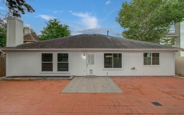 22718 Red Pine Dr, Tomball, TX 77375 - back of house with a patio area, a chimney, a shingled roof, and stucco siding
