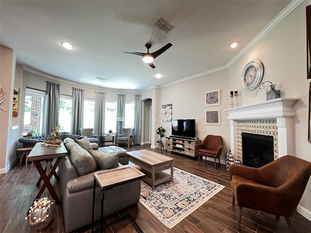 9327 Victory Canyon Ln, Tomball, TX 77375 - living area with a ceiling fan, ornamental molding, plenty of natural light, dark wood-style floors, and arched walkways