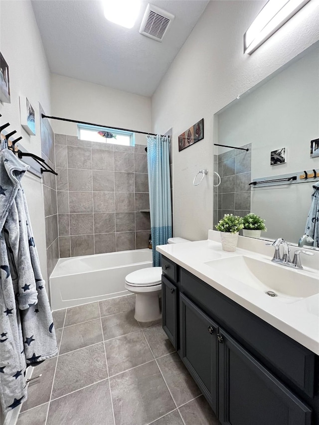 9327 Victory Canyon Ln, Tomball, TX 77375 - bathroom featuring vanity, shower / bath combination with curtain, and tile patterned flooring