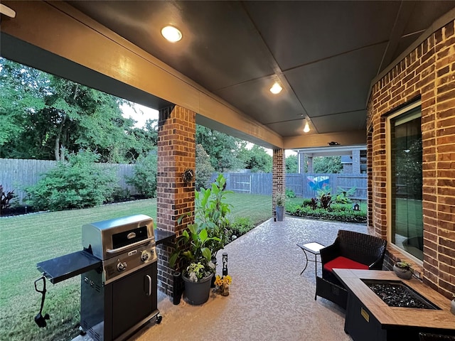 9327 Victory Canyon Ln, Tomball, TX 77375 - fenced backyard with grilling area, a patio area, and a fire pit