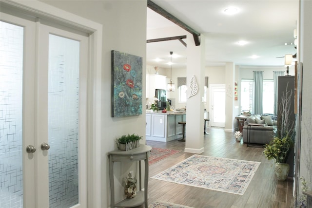 9327 Victory Canyon Ln, Tomball, TX 77375 - corridor featuring wood finished floors and beamed ceiling