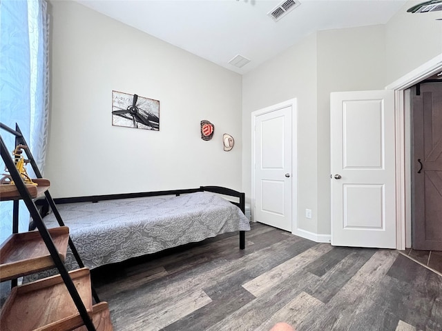 9327 Victory Canyon Ln, Tomball, TX 77375 - bedroom featuring dark wood-type flooring and baseboards