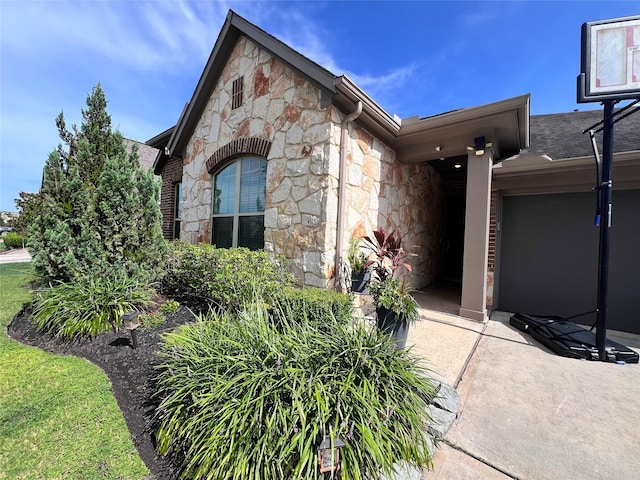 9327 Victory Canyon Ln, Tomball, TX 77375 - doorway to property with stone siding