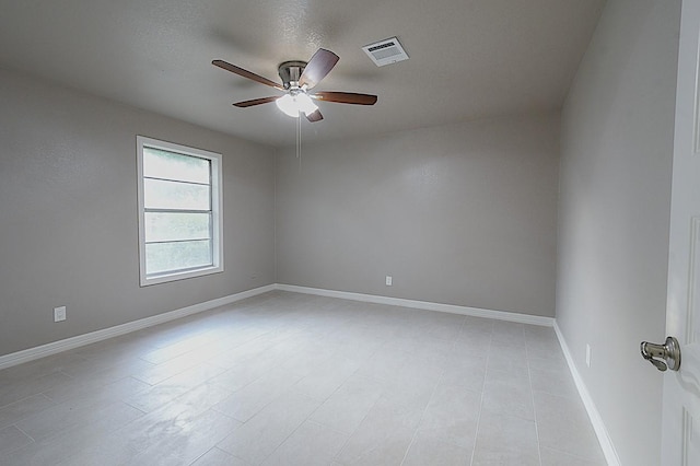 1302 W Adoue St, Alvin, TX 77511 - spare room featuring ceiling fan and baseboards