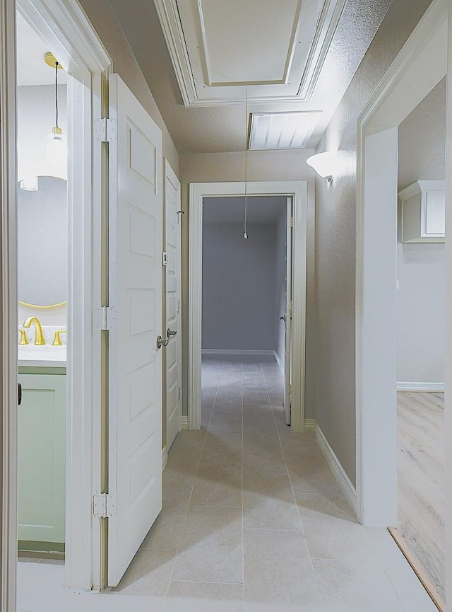 1302 W Adoue St, Alvin, TX 77511 - hall with attic access and light tile patterned floors
