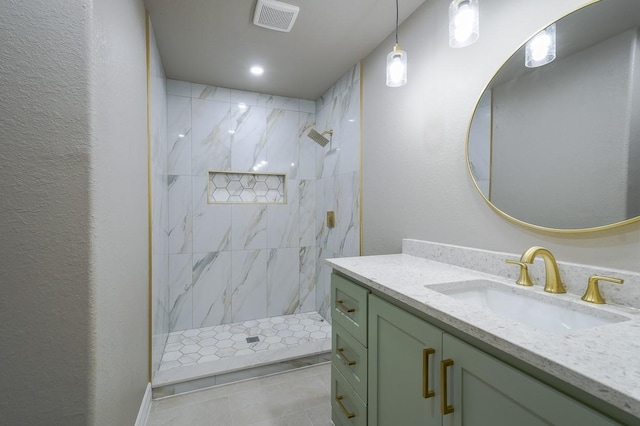 1302 W Adoue St, Alvin, TX 77511 - bathroom with vanity, a marble finish shower, and tile patterned flooring
