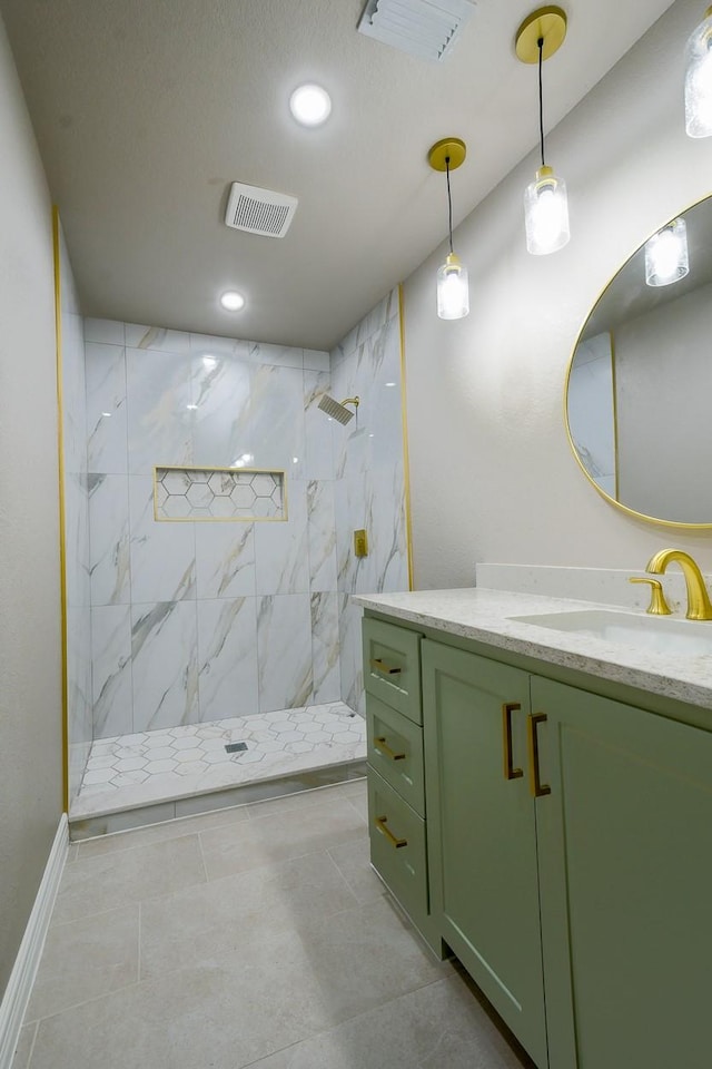 1302 W Adoue St, Alvin, TX 77511 - bathroom with vanity, a marble finish shower, recessed lighting, and tile patterned floors