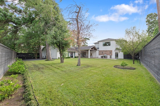 7202 Hartland Ave, Houston, TX 77055 - fenced backyard featuring a patio