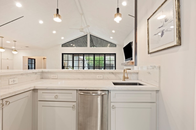 7202 Hartland Ave, Houston, TX 77055 - kitchen featuring lofted ceiling, white cabinetry, light stone counters, hanging light fixtures, and recessed lighting