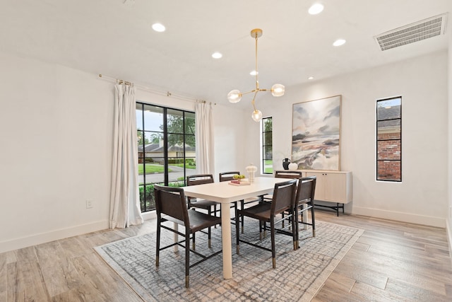 7202 Hartland Ave, Houston, TX 77055 - dining room featuring recessed lighting, a chandelier, and light wood-style flooring