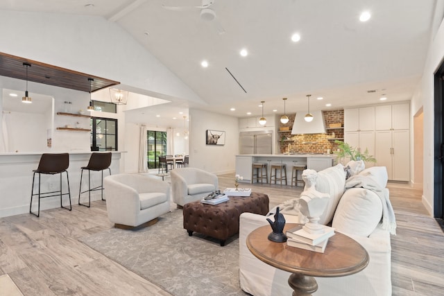 7202 Hartland Ave, Houston, TX 77055 - living area featuring light wood-style floors, high vaulted ceiling, recessed lighting, ceiling fan, and beamed ceiling
